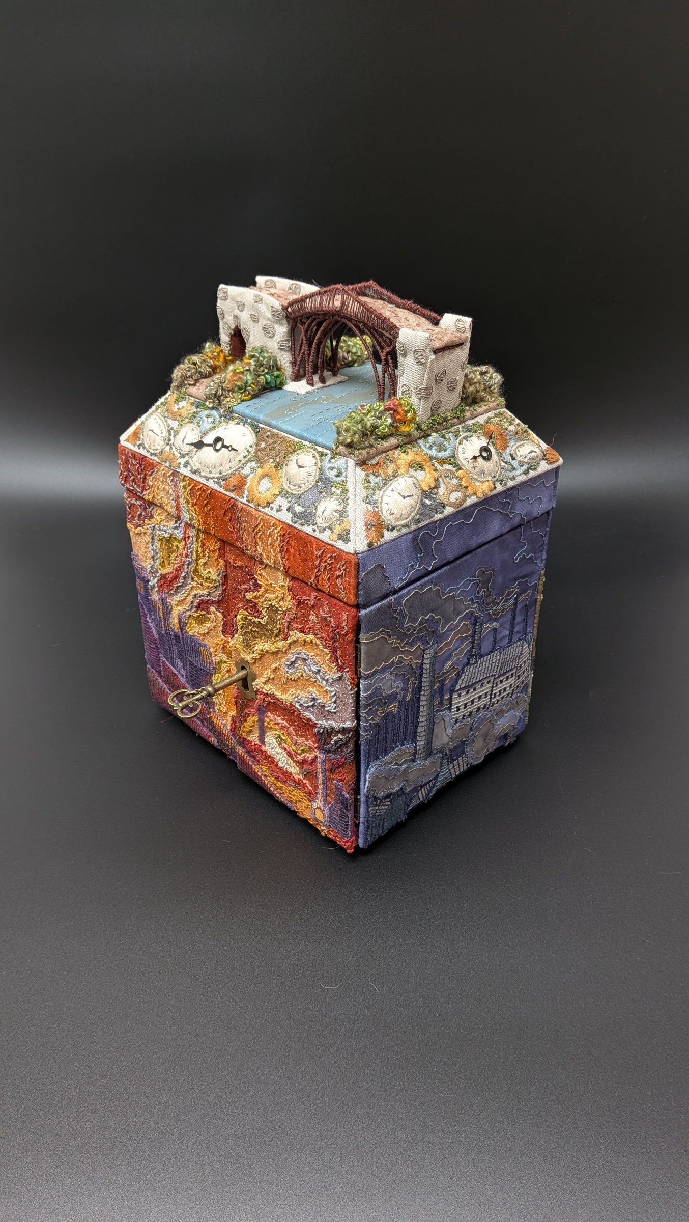 The complete outer embroidered casket at three-quarter angle