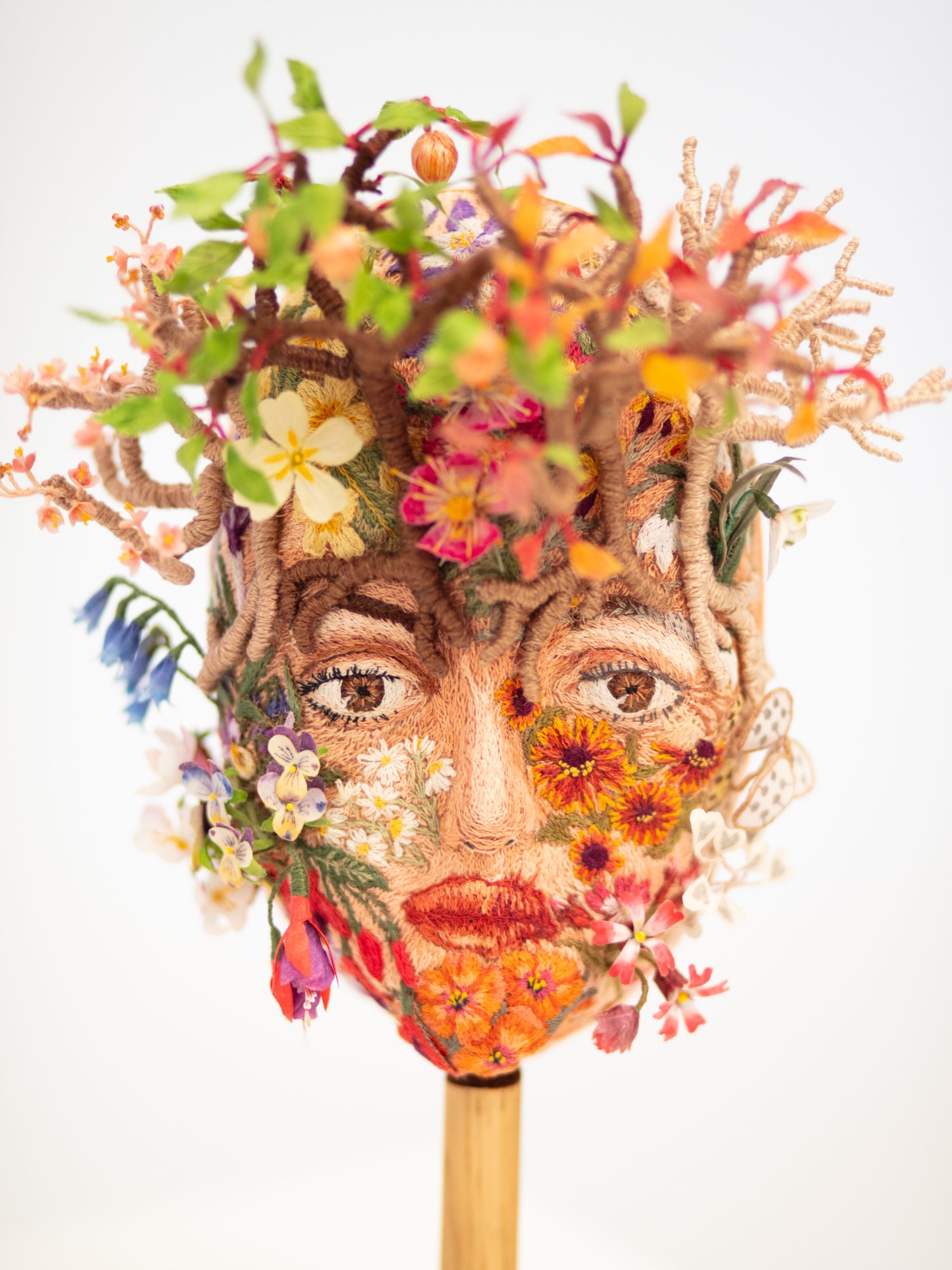 My Metamorphosis, a sculptural embroidered head divided between youth and age