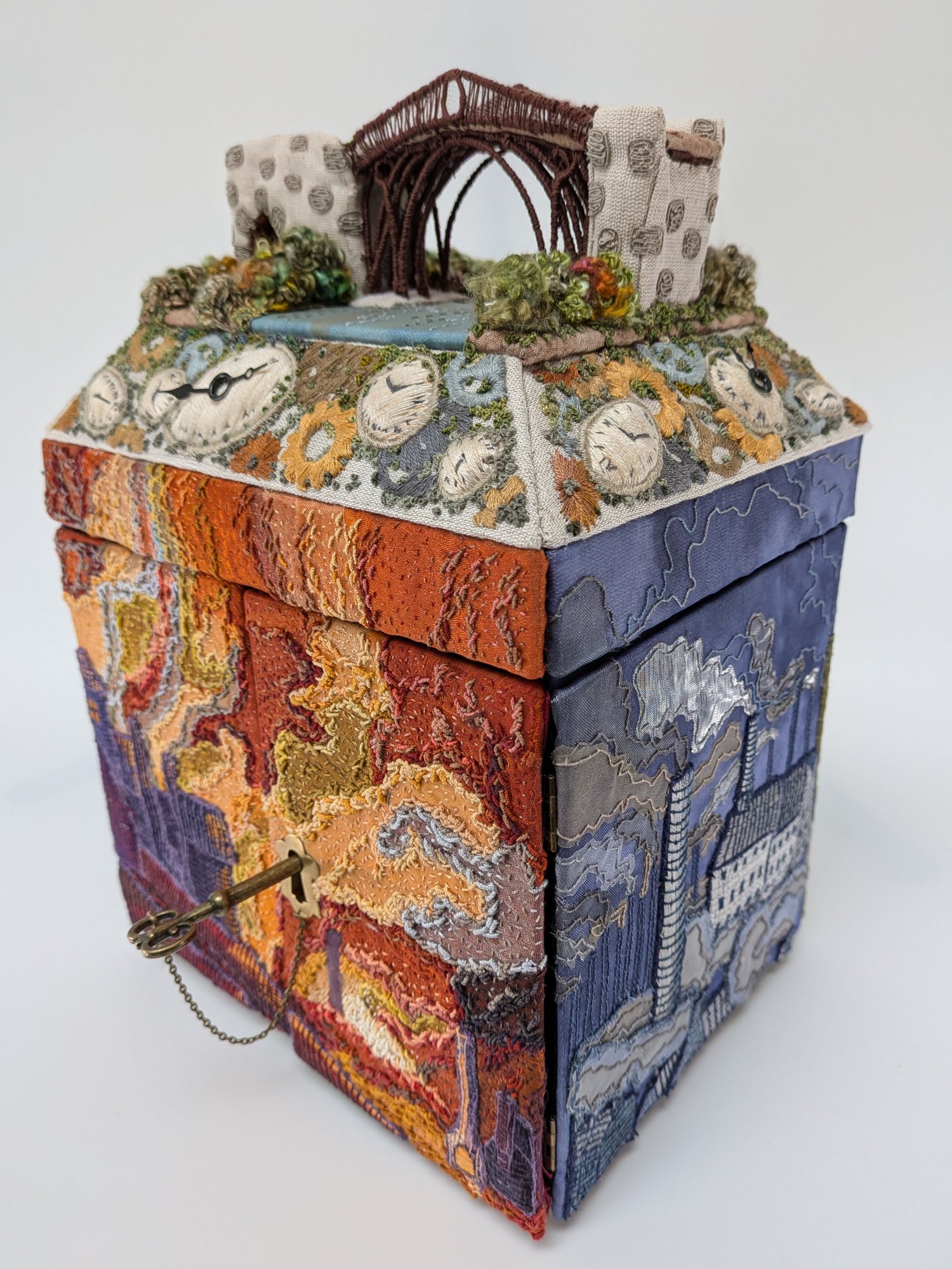 Unveiling the Past, Revealing the Future, a collection of four nested embroidered boxes